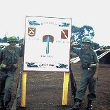 "Uknown Cannon King (Left) & Tom Watkins (Right) Pose By ABtry 6/27th Arty Sign - April 1968"